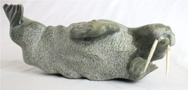 Inuit carving Of Walrus by Donnie Pitsiulak