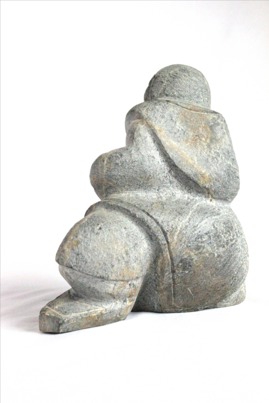 Inuit carving of woman by Thomas Akilak