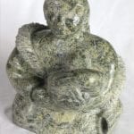 Inuit carving of woman breastfeeding by Elijah Michael
