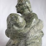 Inuit carving of woman breastfeeding by Elijah Michael