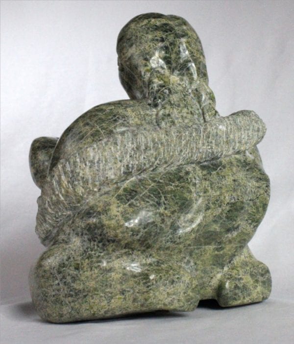 Inuit carving of woman breastfeeding by Elijah Michael