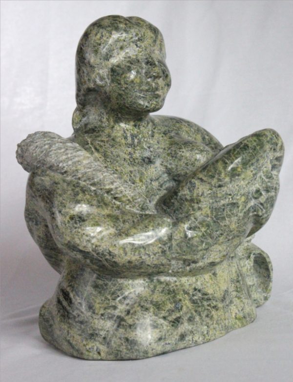 Inuit carving of woman breastfeeding by Elijah Michael