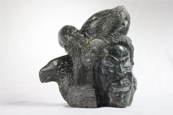 Inuit carving of composition by Mathew Ashevak
