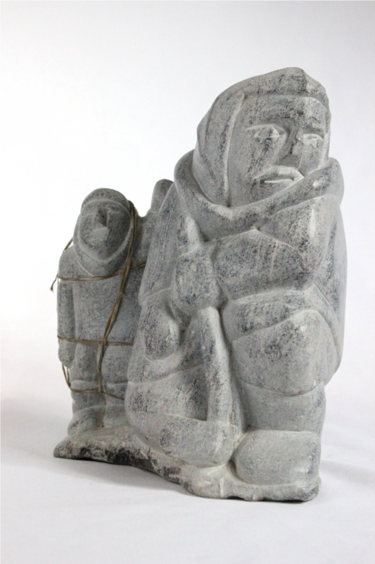Inuit carving of giant and man by Aisa Amittuk