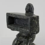 Man Holding Box by Isaaci Etidloie