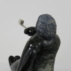 Man smoking pipe carved by Isaaci Etidloie