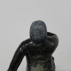 Man smoking pipe carved by Isaaci Etidloie