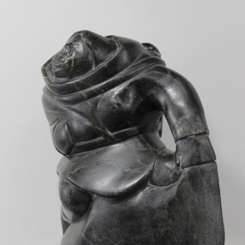 Woman carrying seals Inuit carving