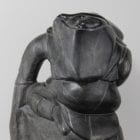 Woman carrying seals Inuit carving