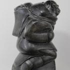 Woman carrying seals Inuit carving