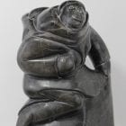 Woman carrying seals Inuit carving