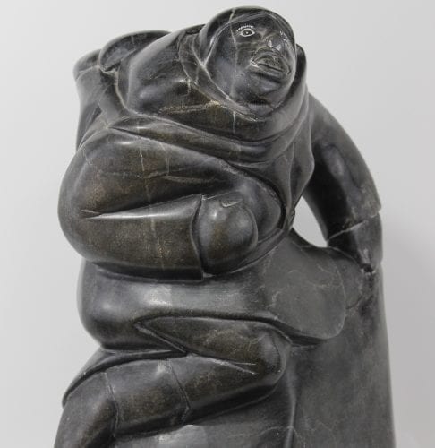 Woman carrying seals Inuit carving