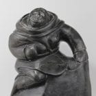 Woman carrying seals Inuit carving