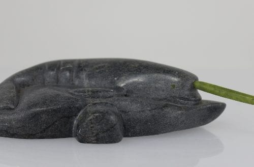 Inuit carving of a narwhale with green tusk