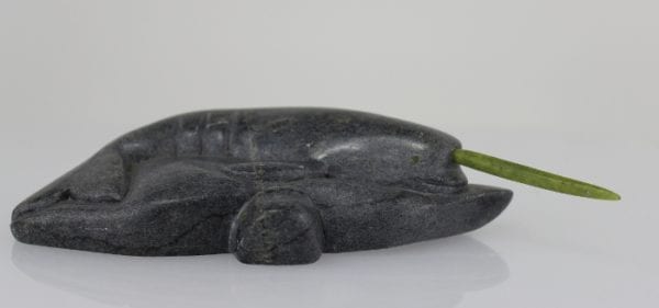 Inuit carving of a narwhale with green tusk