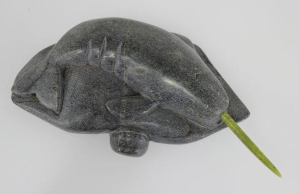 Inuit carving of a narwhale with green tusk