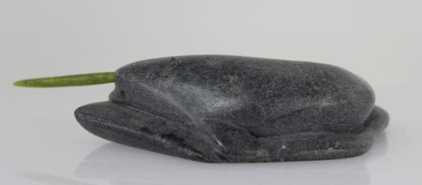 Inuit carving of a narwhale with green tusk