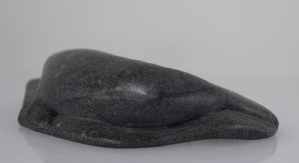 Inuit carving of a narwhale with green tusk