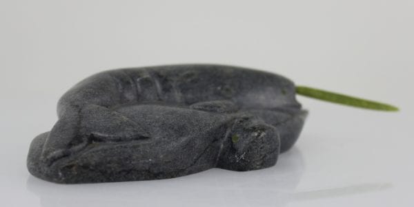 Inuit carving of a narwhale with green tusk