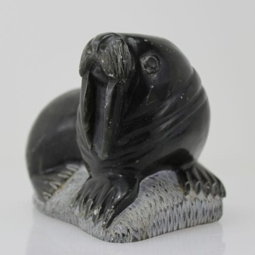 Carving of a walrus on a rock, by unknown Inuit Artist