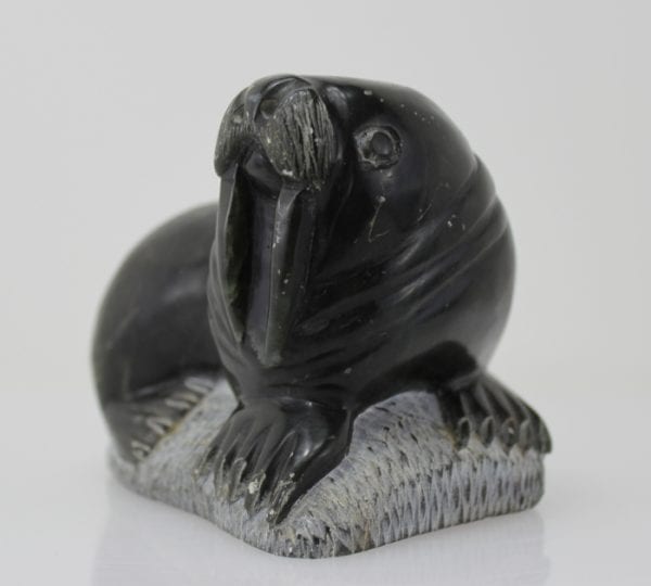 Carving of a walrus on a rock, by unknown Inuit Artist