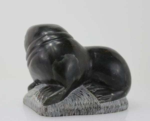 Carving of a walrus on a rock, by unknown Inuit Artist