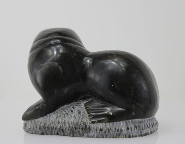 Carving of a walrus on a rock, by unknown Inuit Artist