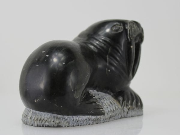 Carving of a walrus on a rock, by unknown Inuit Artist