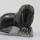 Carving of a walrus on a rock, by unknown Inuit Artist