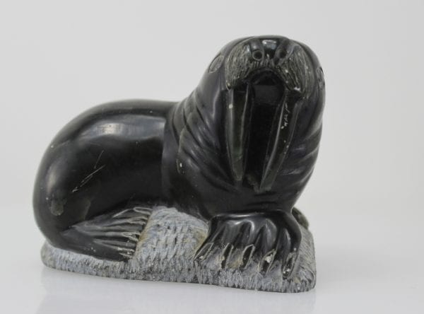 Carving of a walrus on a rock, by unknown Inuit Artist