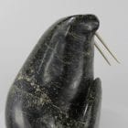 Serpentine walrus carved by Joannie Ikkiduak