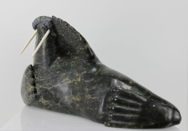 Serpentine walrus carved by Joannie Ikkiduak