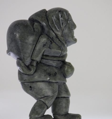 Man carrying seal, carved by Eli Surusila