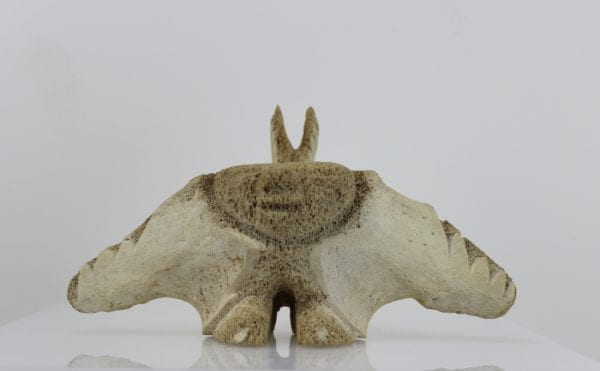 Unique face carved from whalebone by Yassie Kakee, an Inuit artist from Iqaluit