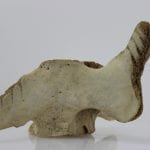 Unique face carved from whalebone by Yassie Kakee, an Inuit artist from Iqaluit