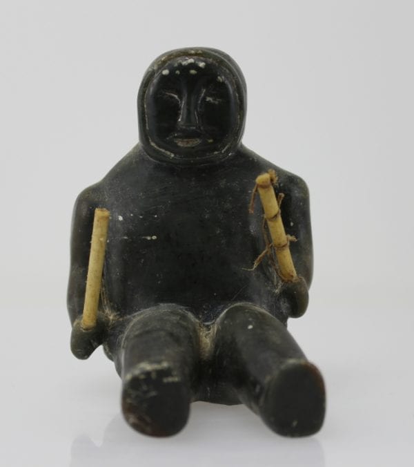 Sitting man with clubs, unknown carver, thought to be from 1960s