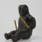 Sitting man with clubs, unknown carver, thought to be from 1960s