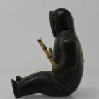 Sitting man with clubs, unknown carver, thought to be from 1960s