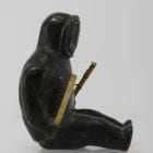 Sitting man with clubs, unknown carver, thought to be from 1960s