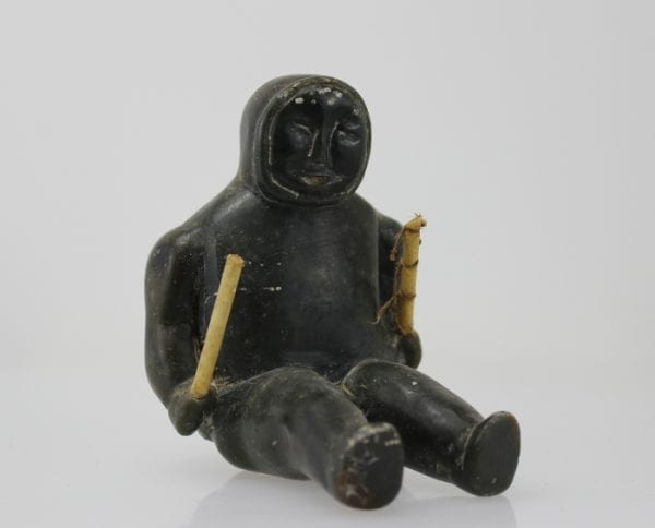 Sitting man with clubs, unknown carver, thought to be from 1960s