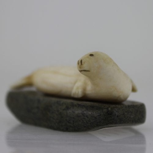 Ivory seal on stone base by unknown Inuit artist