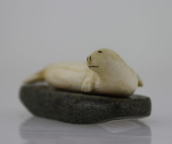 Ivory seal on stone base by unknown Inuit artist