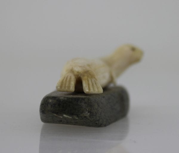 Ivory seal on stone base by unknown Inuit artist