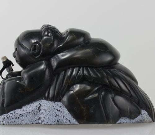 Gorgeous carving of an Inuit woman fishing by Adamie Inukpuk