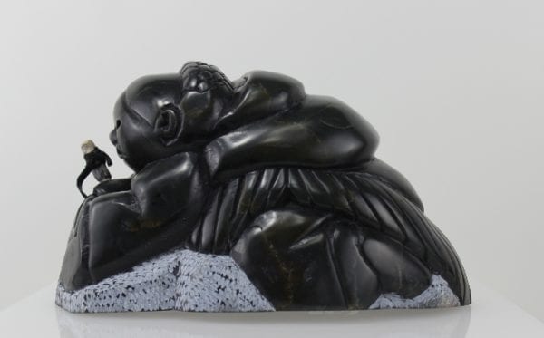 Gorgeous carving of an Inuit woman fishing by Adamie Inukpuk