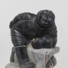 Wonderful carving of a man fishing by an unknown Inuit artist