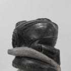 Wonderful carving of a man fishing by an unknown Inuit artist