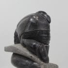 Wonderful carving of a man fishing by an unknown Inuit artist