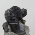 Wonderful carving of a man fishing by an unknown Inuit artist