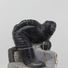 Wonderful carving of a man fishing by an unknown Inuit artist